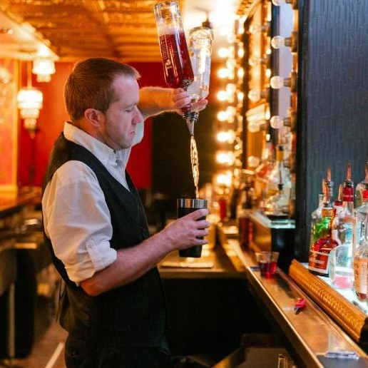 Bartender pouring a cocktail